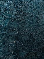 Close up view of a frozen wooden surface covered with hoarfrost crystals, creating intricate and beautiful patterns, showcasing the delicate beauty of nature in winter. frozen wooden background photo