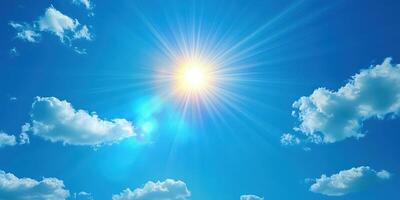 Bright sun shines over a clear blue sky with fluffy clouds on a warm summer day photo