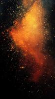 Vibrant explosion of golden dust particles against a deep black background during a creative artistic event photo