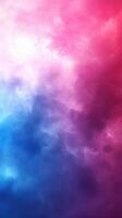 Colorful abstract smoke patterns blend shades of pink, blue, and purple, creating a vibrant visual experience in a dreamy atmosphere photo