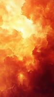 Fiery clouds illuminated by sunlight create a dramatic sky at sunset, showcasing vibrant orange and yellow hues photo