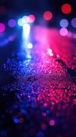Reflections of vibrant lights in a rainy urban street at night showcasing a dazzling array of colors photo