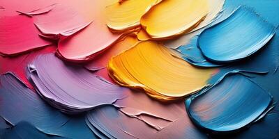 Colorful palette of textured paint displays vibrant hues in an artist's studio during daylight photo