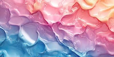 Colorful abstract patterns of paint blending together in shades of pink and blue photo
