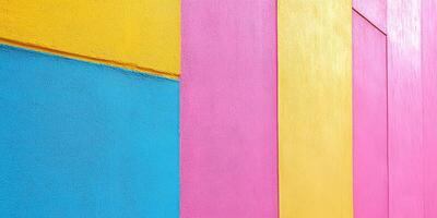 Brightly colored wall mural showcasing vibrant hues of yellow, pink, and blue in an urban setting during daylight hours photo