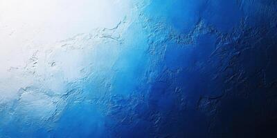 Blue textured wall showcasing a gradient from light to dark, accentuating depth and artistic appeal in a creative space photo
