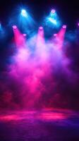 Colorful stage lighting creates an exciting atmosphere for a performance in a darkened venue photo