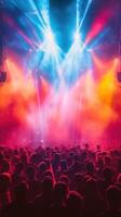 Vibrant concert atmosphere fills the venue with dynamic lights and energetic crowd during live music performance at night photo