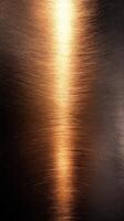 Shimmering copper surface with subtle textures and reflections illuminated by soft lighting photo
