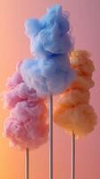 Colorful cotton candy displayed against a warm gradient background showcasing pastel hues photo