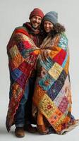 Cozy couple shares warmth under a colorful quilt in a modern studio during winter season photo