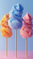 Colorful cotton candy sticks displayed on a pastel-colored background at a fair or carnival photo
