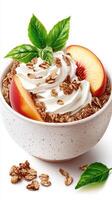 Delicious bowl of creamy yogurt topped with sliced peaches and crunchy granola photo
