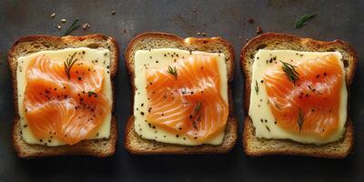 Delicious slices of smoked salmon on toasted bread with creamy cheese and herbs prepared for a gourmet snack photo