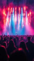 Exciting night concert with vibrant lights and enthusiastic crowd at a music festival in an urban venue photo