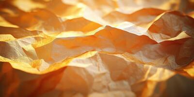 Textured orange paper with soft folds and gentle shadows under warm lighting photo