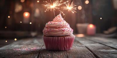 Sweet celebration with a cupcake topped with sparklers glowing warmly during a cozy evening gathering photo