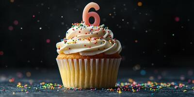 Colorful birthday cupcake decorated with sprinkles and a number six candle for a child's celebration photo