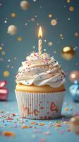 Celebration cupcake with a candle surrounded by colorful decorations on a festive background photo