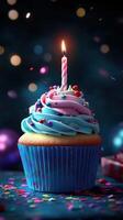 Colorful birthday cupcake with candle on a festive table celebrating a special occasion at night photo
