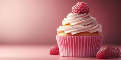 Delicious raspberry cupcake with fluffy frosting and fresh berries on a soft pink background photo