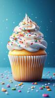 Deliciously decorated cupcake with sprinkles set against a vibrant blue background creates a festive atmosphere photo