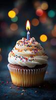 Delicious cupcake with colorful sprinkles and a lit candle celebrating a joyful occasion in a festive atmosphere photo