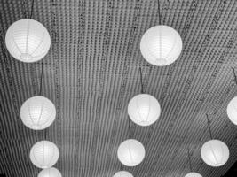 Soft glowing paper lanterns hang elegantly from the ceiling, creating ambiance photo