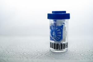 close-up of a container for cleaning and storing contact lenses for the eyes. used at home. For soft and hard lenses. in the container there is an active cleaning process, bubbles are released. photo