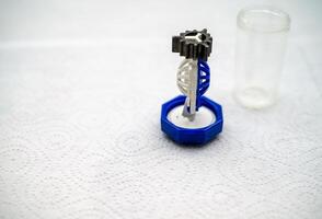 container for cleaning and storing contact lenses for eyes, used at home. For soft and hard lenses. the container consists of two parts, the first part for lenses, the second part for liquid photo