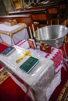 Close-up of a table used for preparing for baptism in an Orthodox church photo