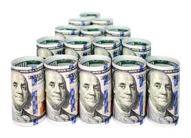 Twisted banknotes one hundred dollars isolated on a white background photo