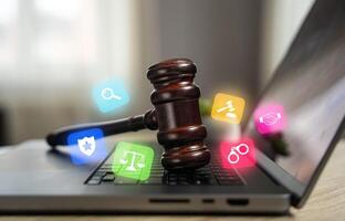Judge's hammer on a laptop. Legal assistance. Legislative regulation of digital systems, cyberspace and Internet technologies. Data protection, online privacy, and internet legislation. photo
