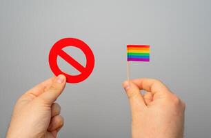 Ban on LGBT movements and media coverage. Concept of censorship, human rights restrictions. Freedom of speech violations, societal discrimination, and marginalized community struggles. photo