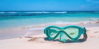 A pair of goggles and snorkel on the beach photo