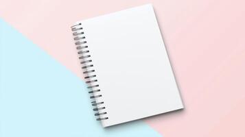 A blank notebook on a pink and blue background photo