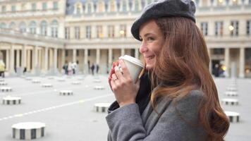 Smiling Girl with Coffee at Royal Palace Square in Paris video