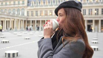 Close-Up of Parisian Woman Drinking Coffee at Royal Palace Square video