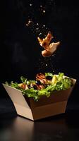 A dynamic shot of a grab-and-go salad in a cardboard box with fresh lettuce, grilled chicken, olives, and lemon dressing. The flying ingredients add energy to the scene. . photo