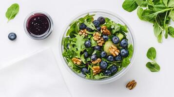 A visually stunning fresh salad with nuts and berries, captured in a modern and stylish setting. Grab-and-Go Salad. . photo