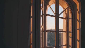 A window with a view of the sun setting video