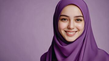 Smiling Woman in Purple Hijab - Radiant Beauty and Culture photo