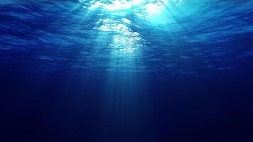 Underwater ocean waves oscillate and flow with the rays of light. 4K UHD seamless loop video