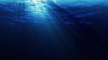 Underwater ocean waves ripple and flow with light rays. 4K UHD seamless loop video