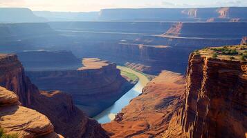 Panoramic view of a deep river canyon with towering red rock cliffs, bathed in sunlight, offering a sense of depth and natural grandeur. photo