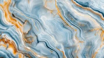 An abstract backdrop features swirling patterns of blue and gold, evoking marble or stone textures in a captivating, fluid design. photo