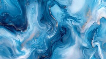 Abstract fluid art in vibrant blue and white hues, accented with delicate gold shimmer, creating a dynamic, marbled pattern. photo