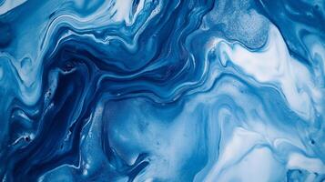 Swirling blues and whites create a captivating abstract pattern reminiscent of ocean waves or marbled textures. Elegant design for many uses. photo