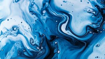 Swirling shades of blue and white create an abstract marble effect, blending fluid textures and evoking movement in this unique artwork. photo