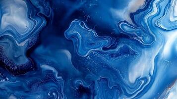 Abstract swirls of deep and light blues blend together like ocean currents, creating an artistic and mesmerizing visual texture. photo